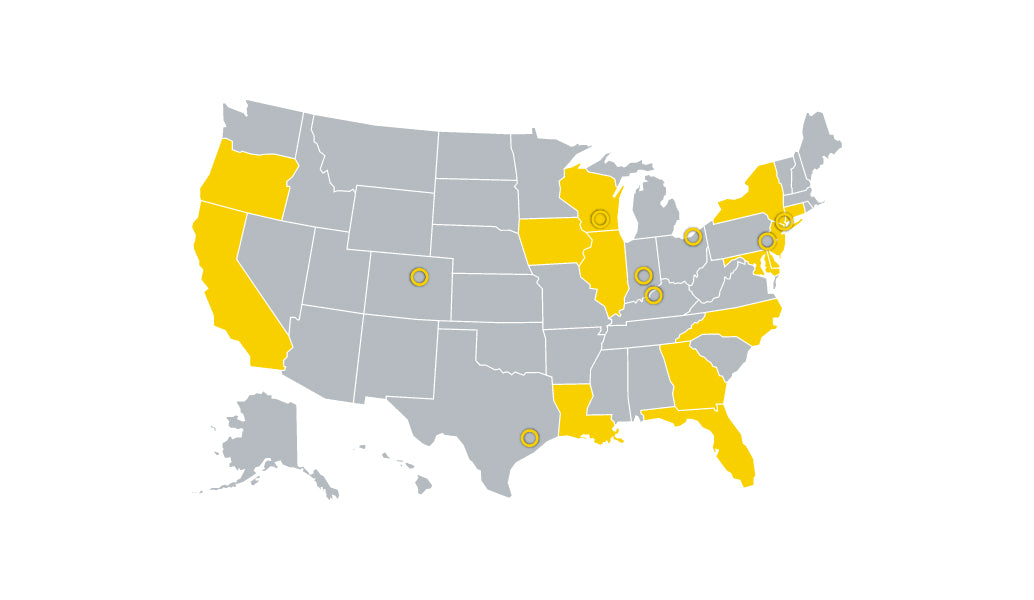US map showing states in yellow that require 10-year battery alarms in multi-family homes